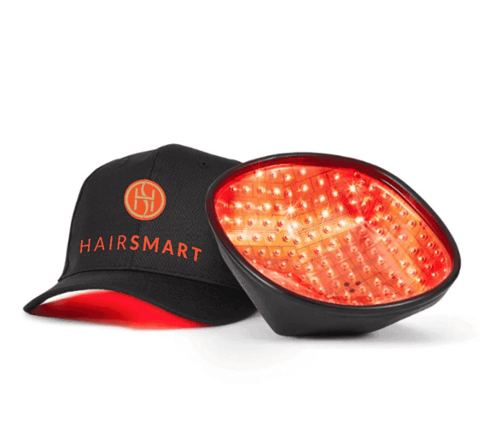 LED hair growth cap with "HAIRSMART" branding, featuring illuminated red lights inside.