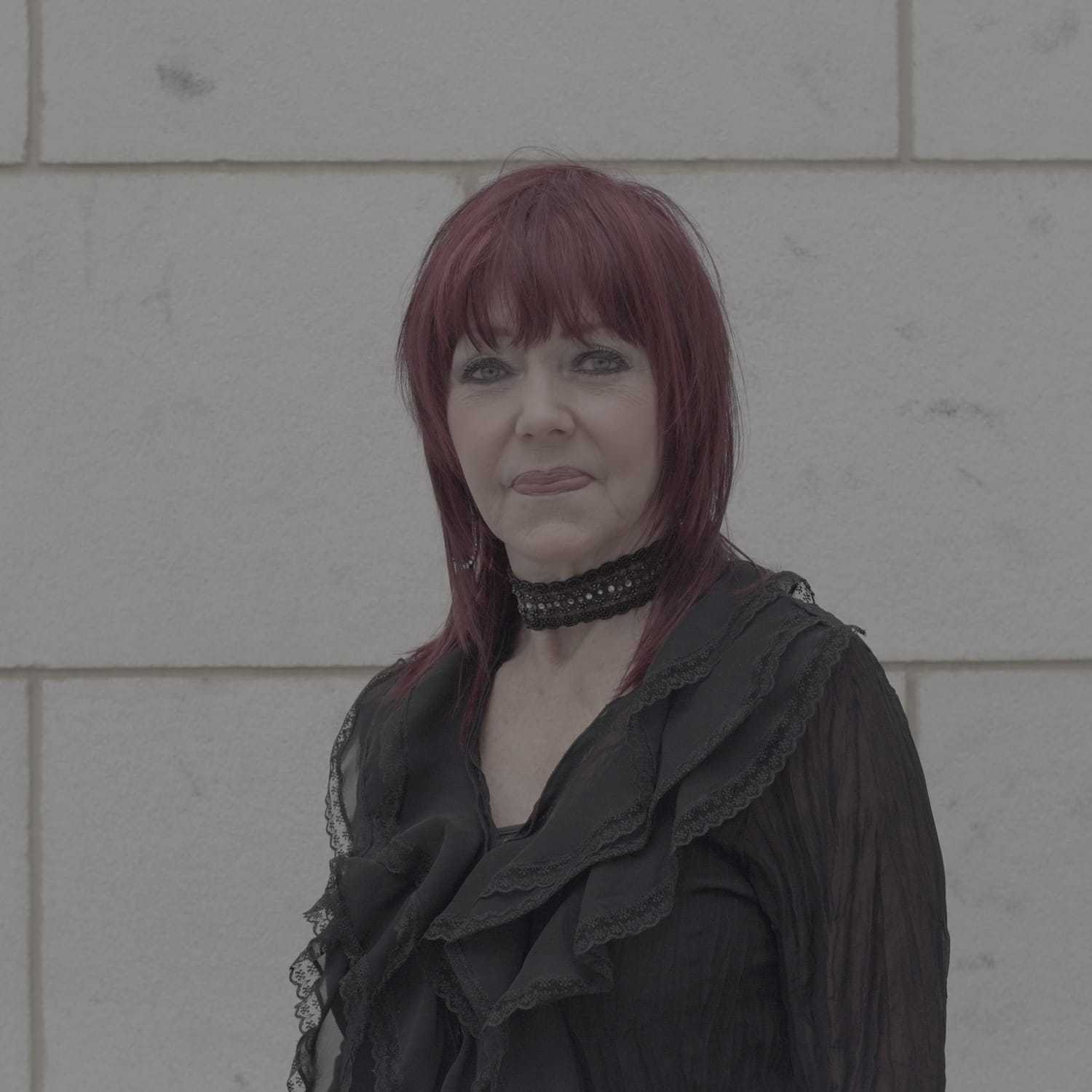 Portrait of Susan, a professional stylist at Cenergi Salon & Boutique, showcasing their expertise and style.